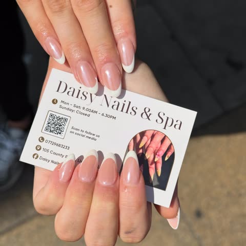 Client with a classic French set holding a business card