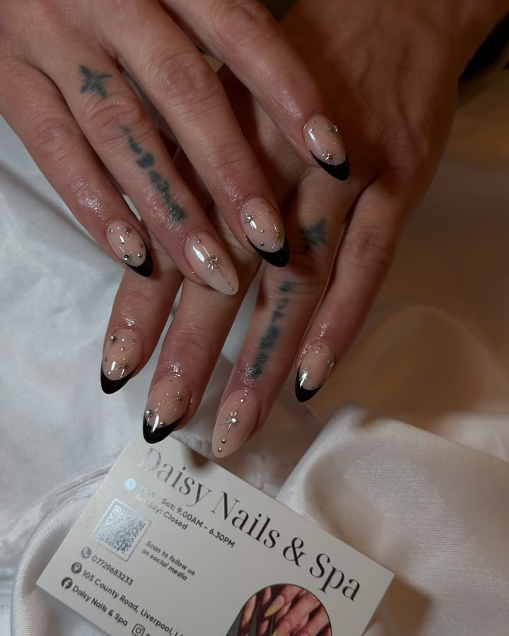 Black French tips with a touch of sparkle