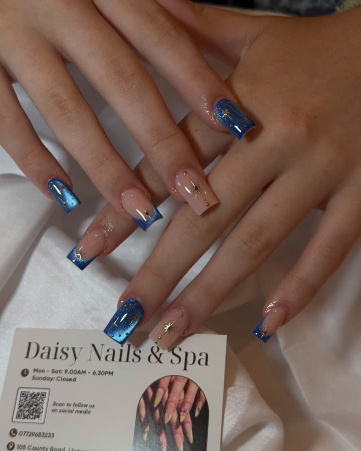 Blue cat-eye nails with gold detail