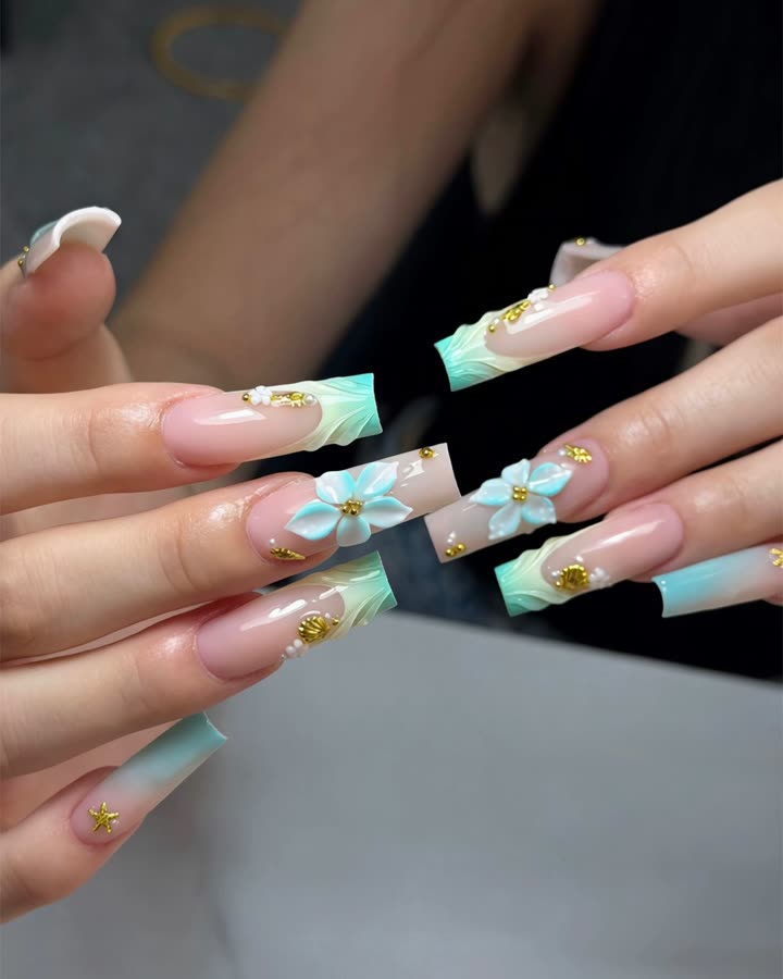 Turquoise ombré French tips with 3D flowers and gold beads