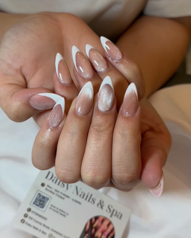Classic white French tips on almond-shaped nails