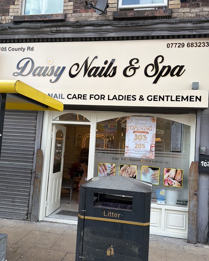 The Daisy Nails and Spa shopfront on County Road, with a yellow awning and the sign 'nail care for ladies and gentlemen'